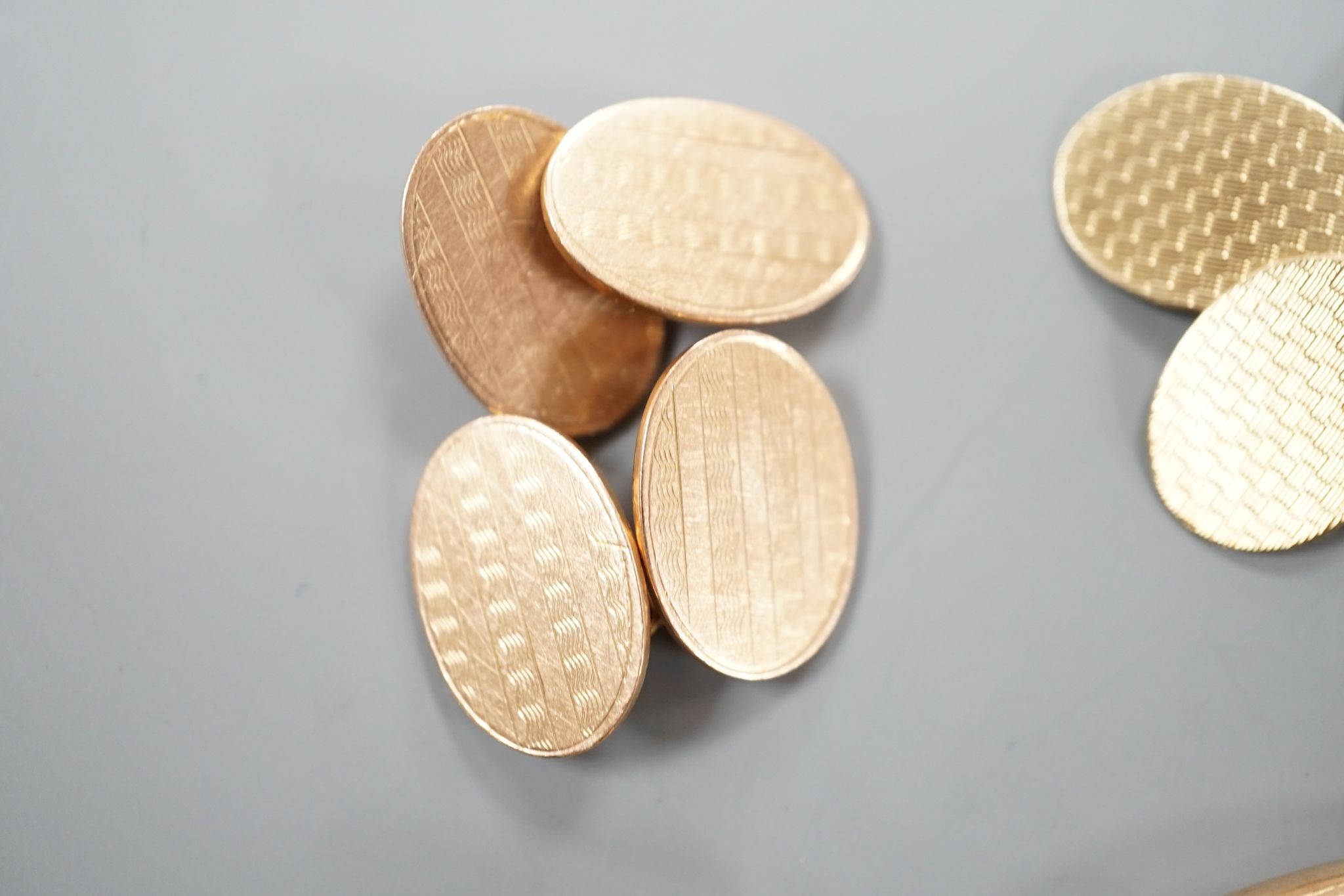 Four assorted pairs of 9ct gold cufflinks including engine turned